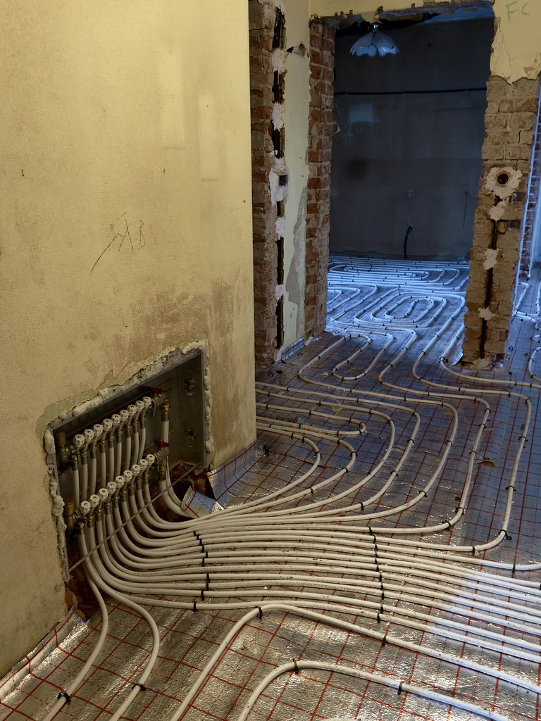 Under-floor heating system installation showing professional preparation work